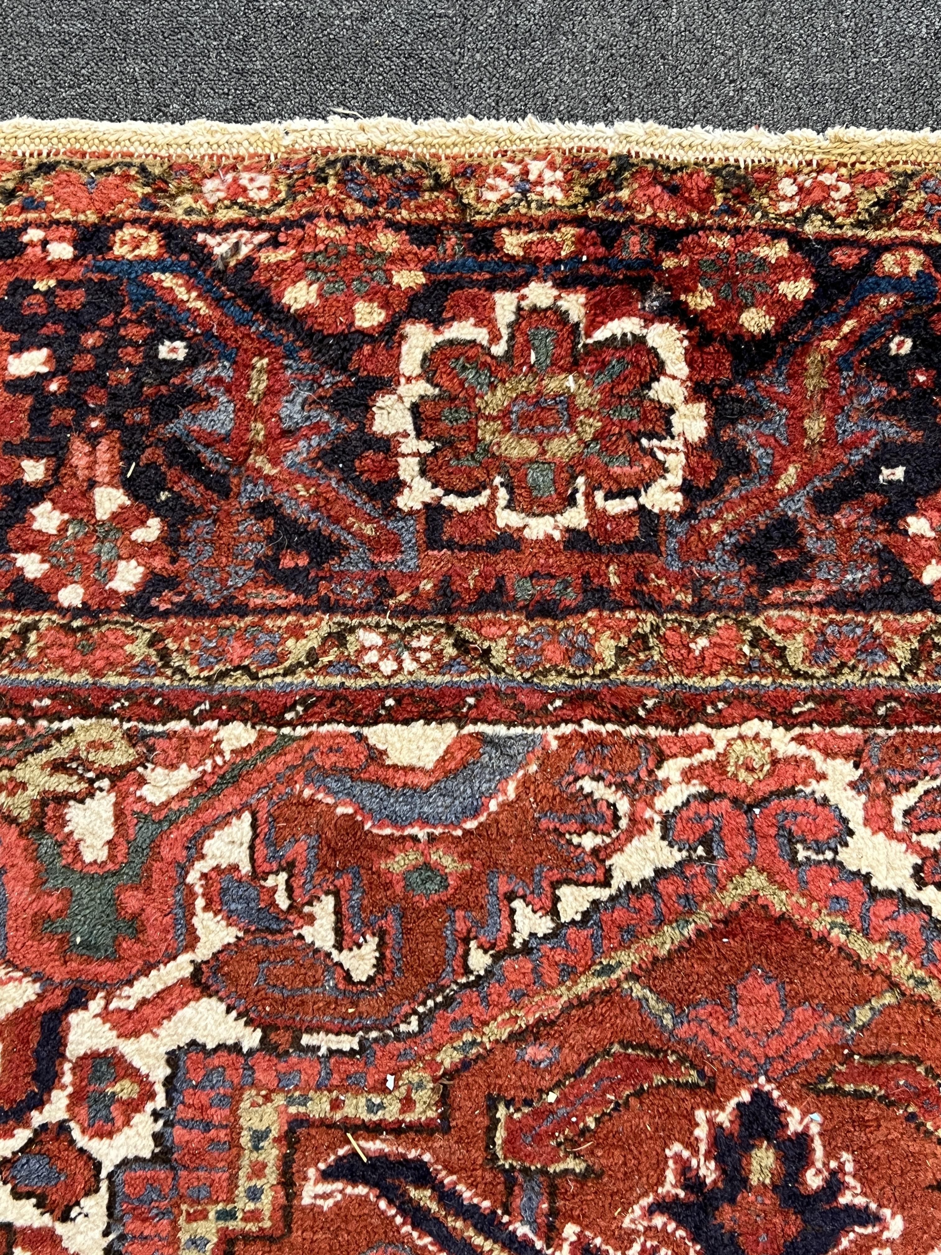 An antique Heriz carpet, 410 x 295cm